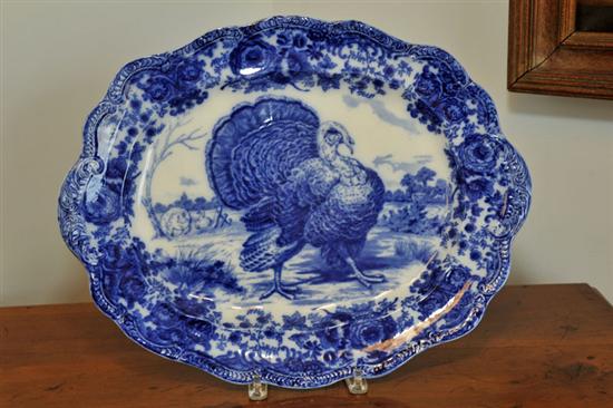 Appraisal: RIDGWAYS FLOW BLUE PLATTER Depicting a turkey with a floral