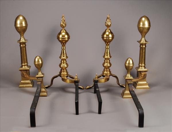 Appraisal: A pair of brass and cast iron mounted andirons in