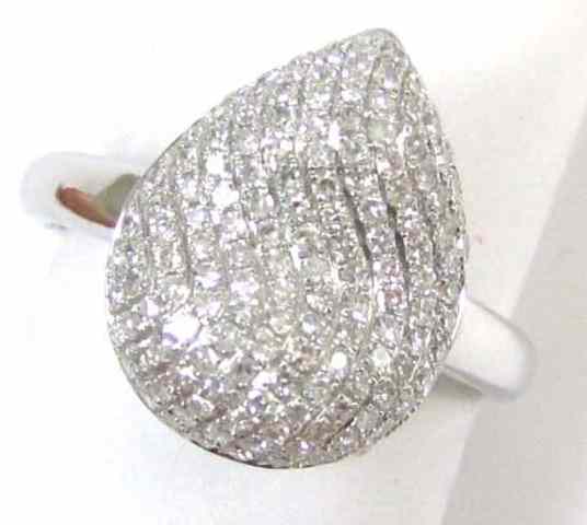 Appraisal: DIAMOND AND FOURTEEN KARAT GOLD RING the white gold pear