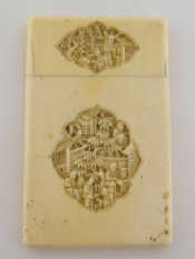 Appraisal: An ivory card case with relief carved panels of garden