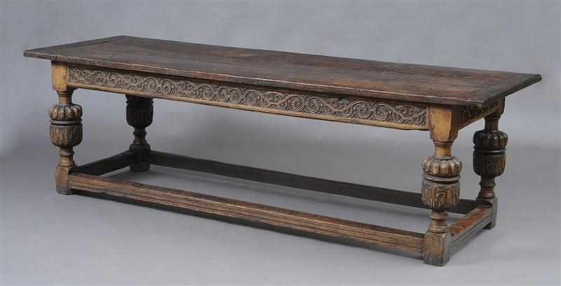 Appraisal: JACOBEAN STYLE CARVED OAK REFECTORY TABLE The three-plank top with