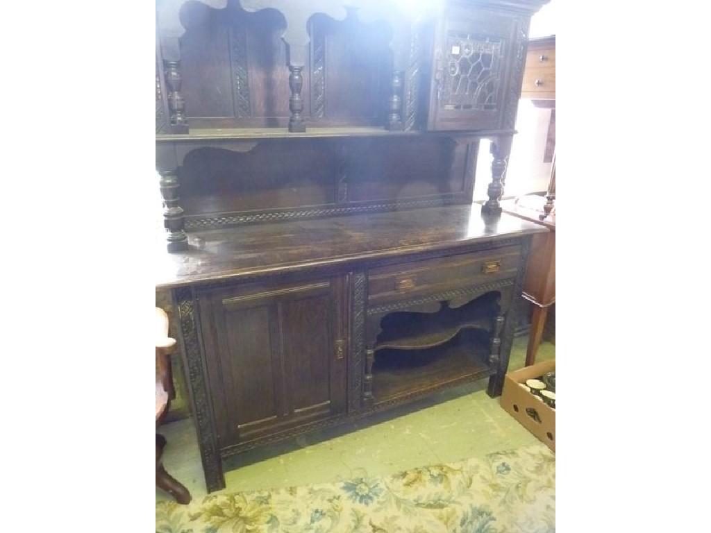 Appraisal: A Victorian oak dresser the upper section partially enclosed by