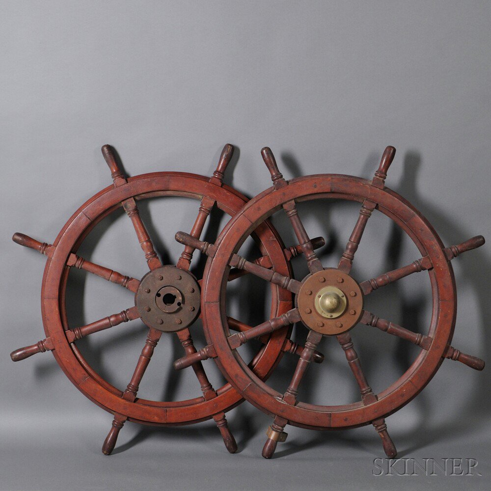 Appraisal: Pair of Mahogany and Cast Iron Ship's Wheels America th