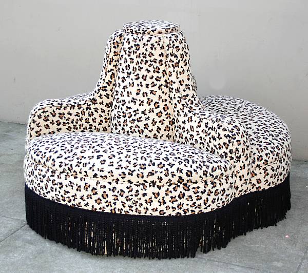 Appraisal: A Contemporary leopard print upholstered circular banquette