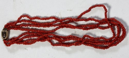 Appraisal: A coral necklace the four rows of red beads to