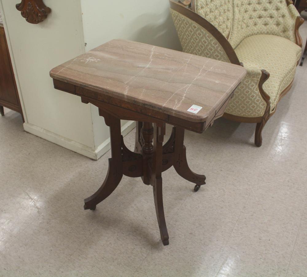 Appraisal: TWO VICTORIAN MARBLE-TOP WALNUT LAMP TABLES Charles Eastlake design late