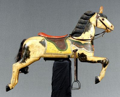 Appraisal: Wooden carousel horse carved and caparisoned galloping horse shield at