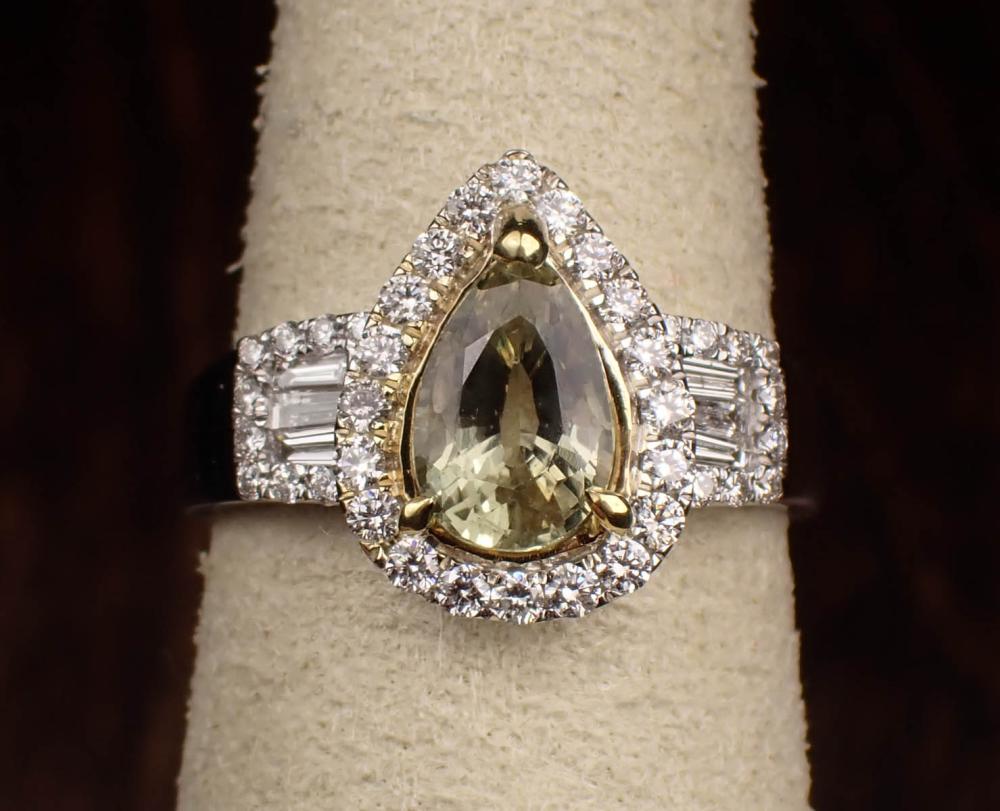 Appraisal: YELLOWISH GREEN SAPPHIRE AND DIAMOND RING The k white gold