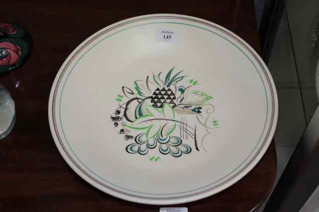 Appraisal: A POOLE POTTERY DISH decorated with pineapples and other fruit