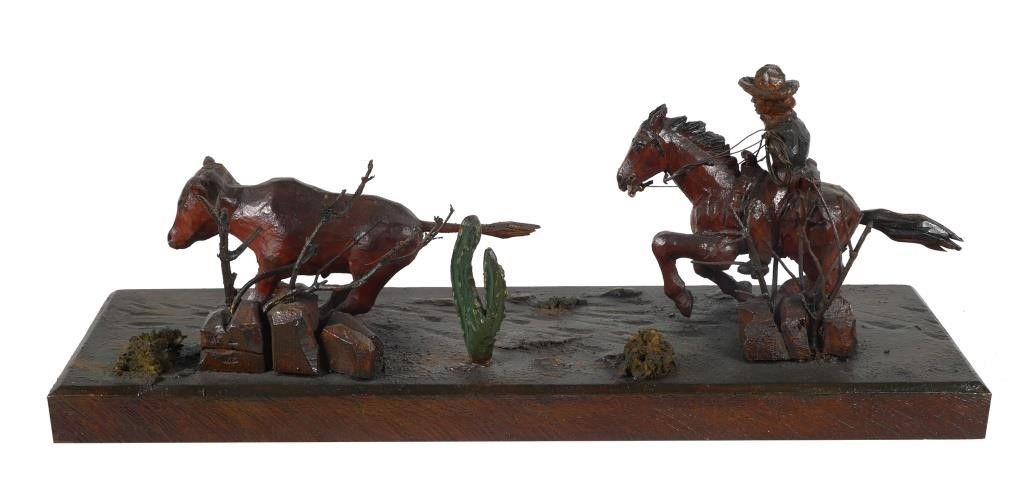 Appraisal: Hand carved and painted wooden sculpture of a cowboy on