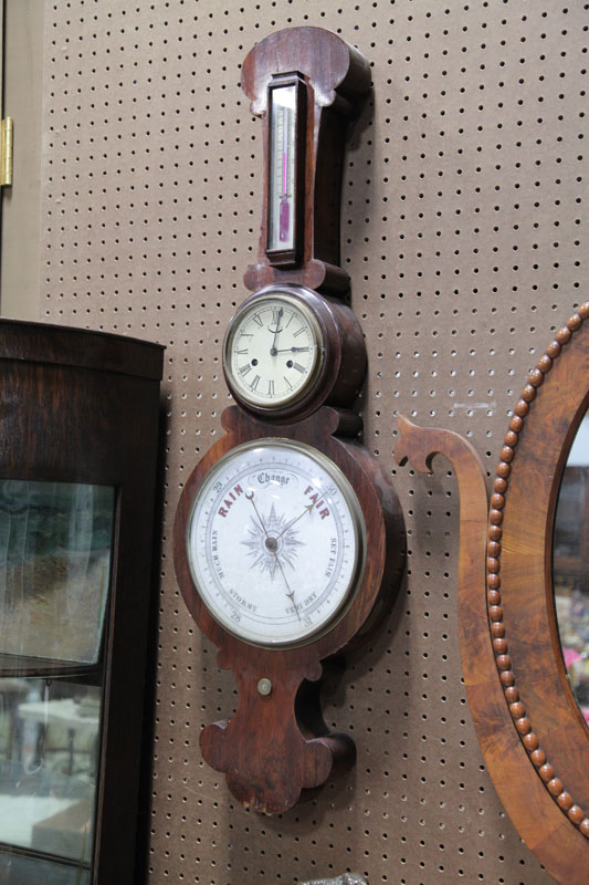 Appraisal: BAROMETER WITH CLOCK AND THERMOMETER Brass works with balance wheel