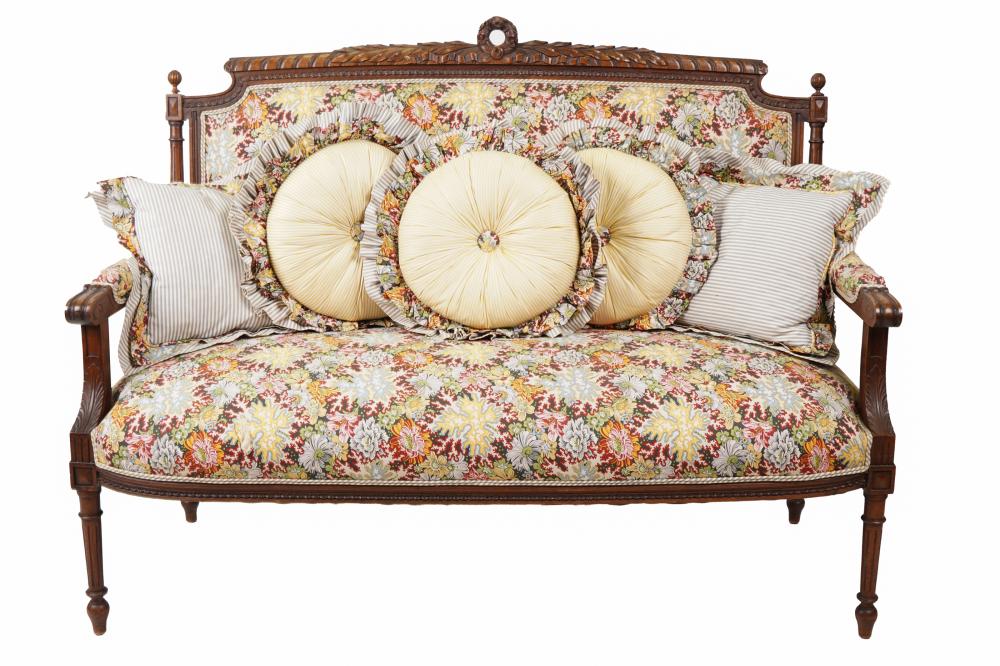 Appraisal: LOUIS XVI STYLE SETTEEcarved walnut covered with floral cotton fabric