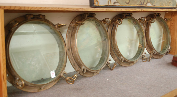 Appraisal: A SET OF FOUR BRASS PORTHOLES removed from an American