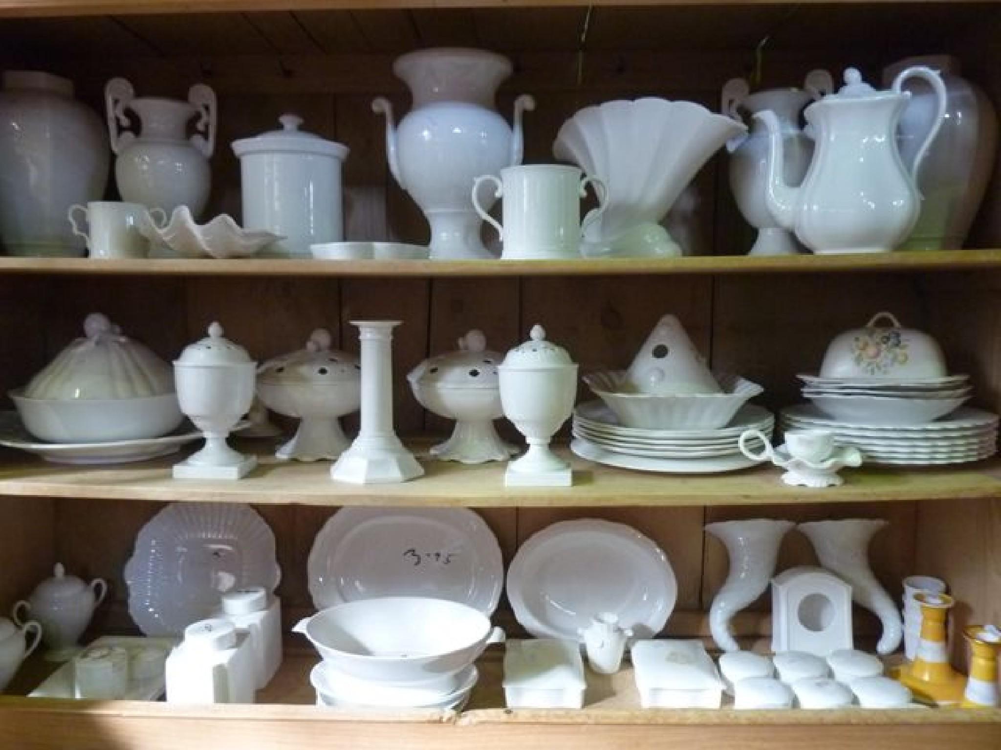 Appraisal: A quantity of white glazed ceramics including urn shaped vases