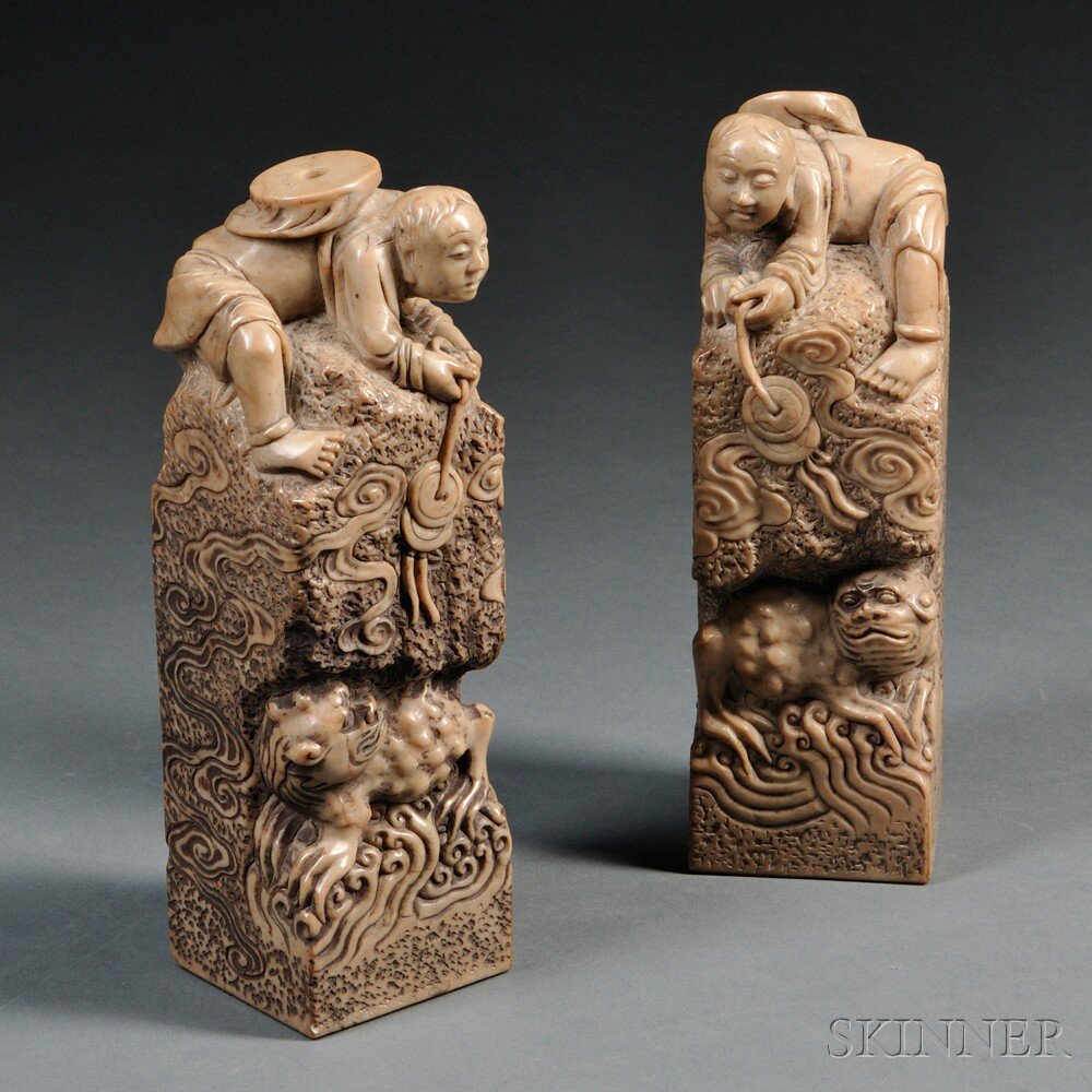 Appraisal: Pair of Soapstone Seals China rectangular each surmounted by a