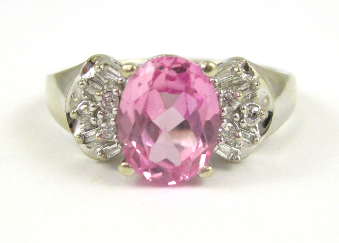 Appraisal: PINK SAPPHIRE DIAMOND AND TEN KARAT GOLD RING The white