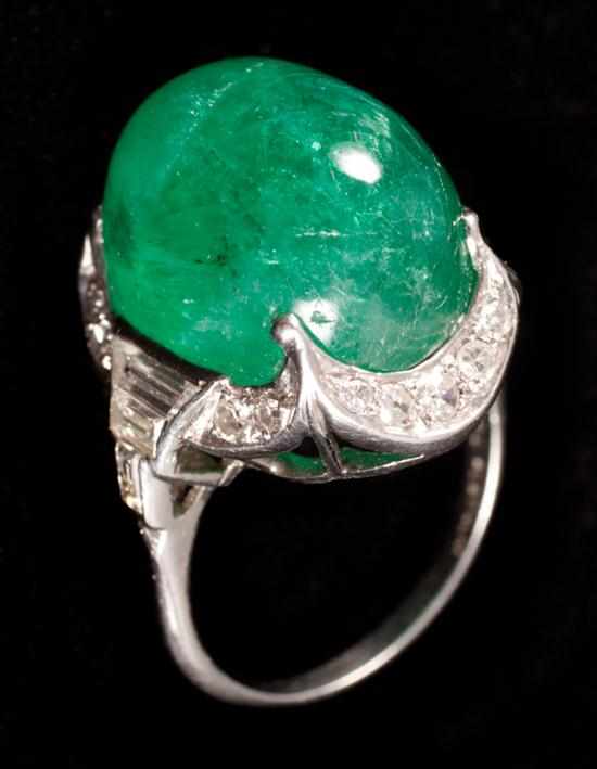 Appraisal: cts emerald cabochon ring center cabochon emerald approximately cts framed