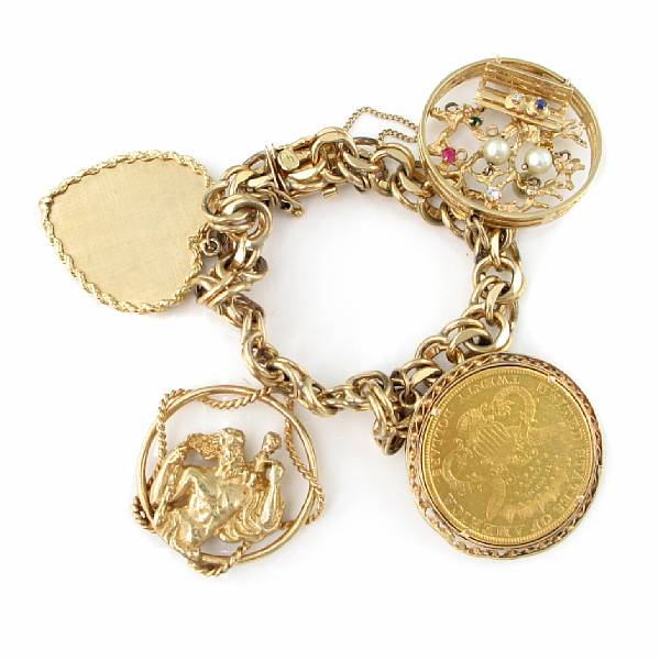 Appraisal: A k gold charm bracelet suspending one gold coin and