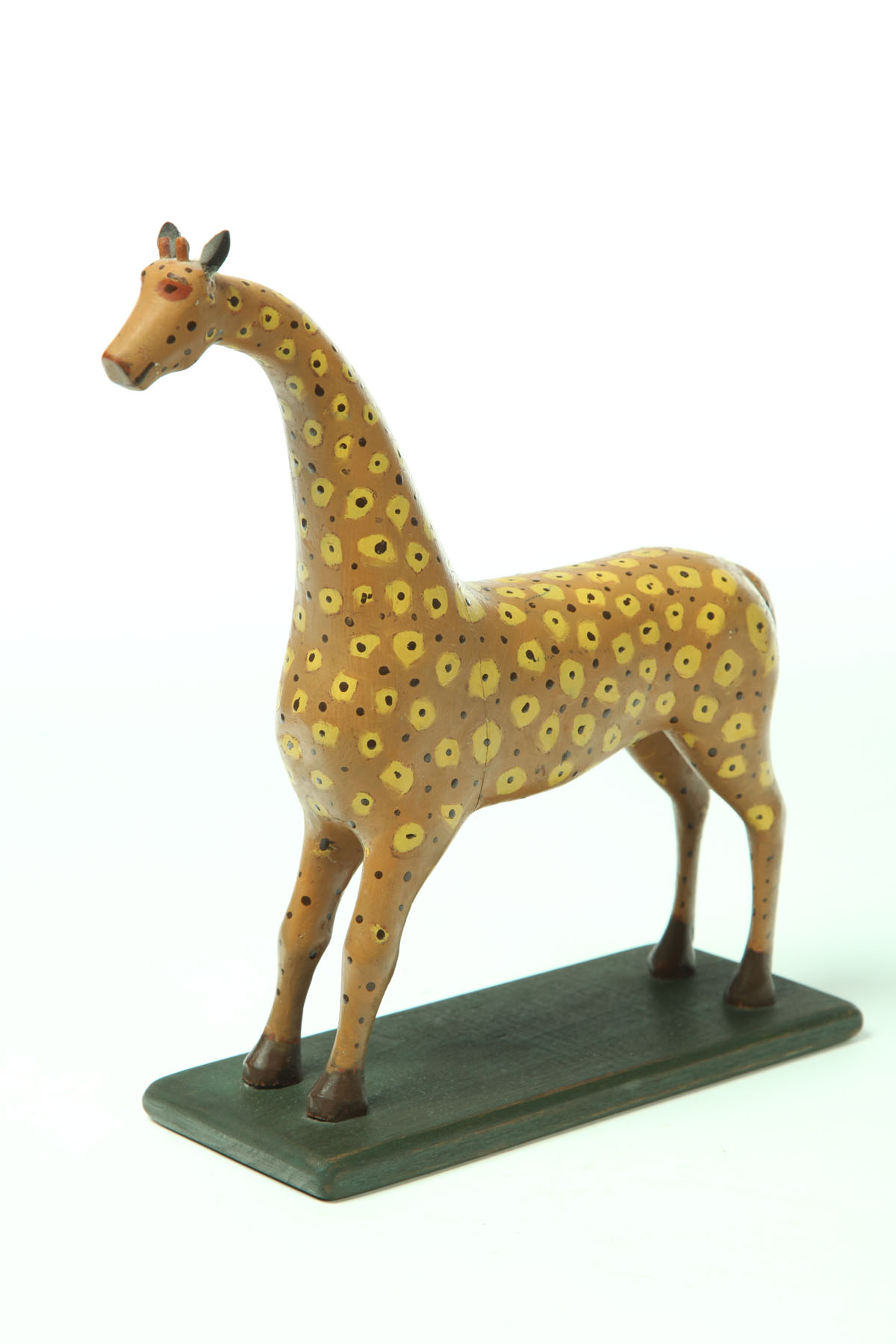 Appraisal: FOLK ART GIRAFFE CARVING American th century pine Folksy giraffe