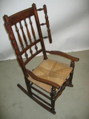 Appraisal: A BEECH AND ELM WING ROCKING CHAIR of spindle back