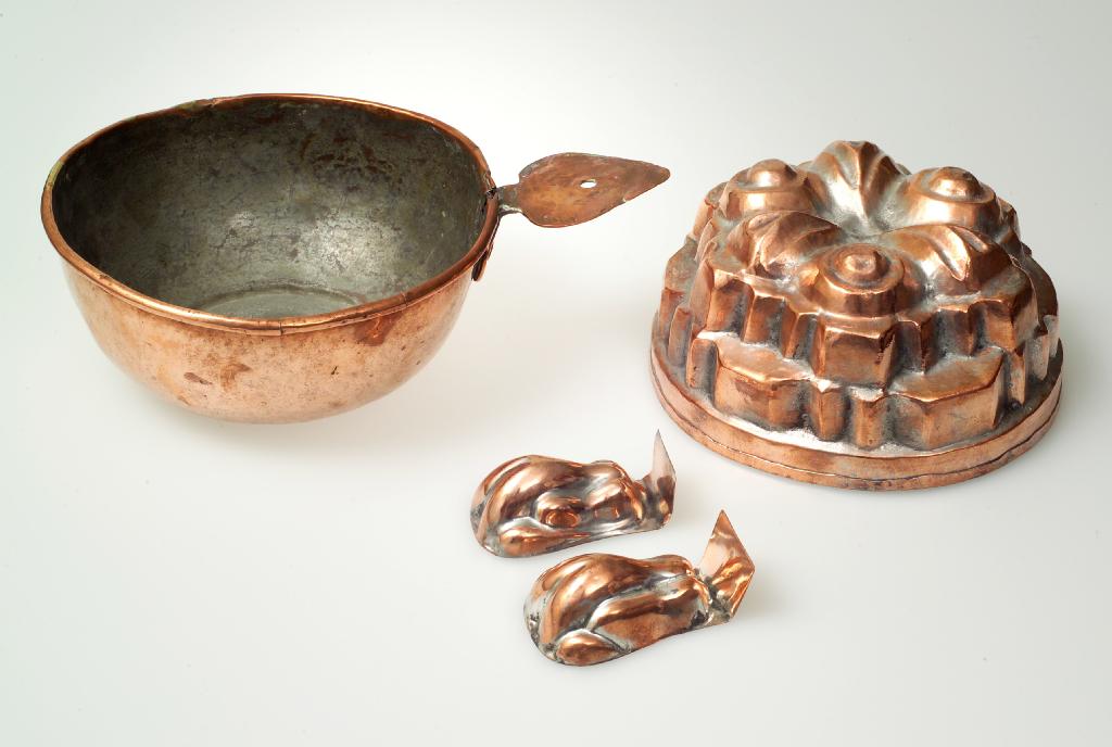 Appraisal: COPPER BLEEDING BOWL probably th century with heart-shaped handle Length