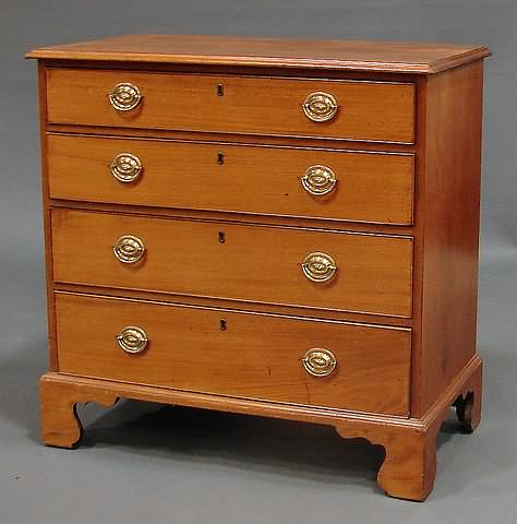 Appraisal: Molded oblong top graduated cock-beaded drawers oval brasses replaced straight