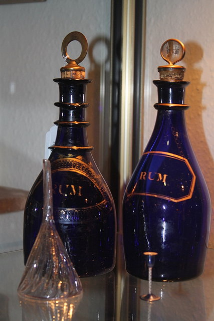 Appraisal: TWO BRISTOL BLUE GLASS DECANTERS each inscribed Rum th Century