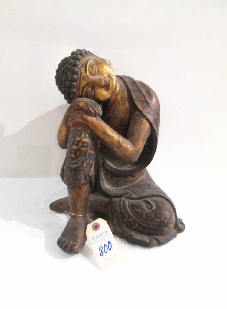 Appraisal: CARVED AND PARCEL GILDED WOOD BUDDHA hand carved in seating