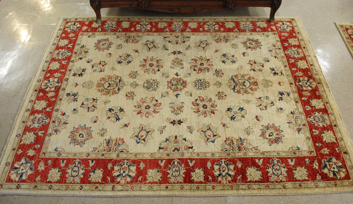 Appraisal: HAND KNOTTED ORIENTAL AREA RUG Pakistani-Persian floral arabesque design on