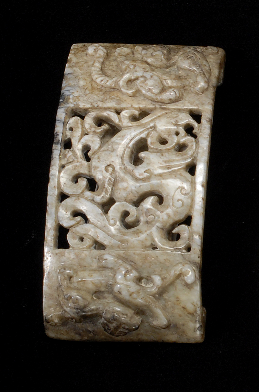 Appraisal: MOTTLED GRAY JADE BELT SLIDE Ming DynastyWith relief carving of