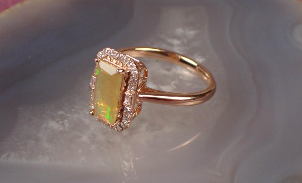 Appraisal: FIRE OPAL DIAMOND AND FOURTEEN KARAT GOLD RING The rose