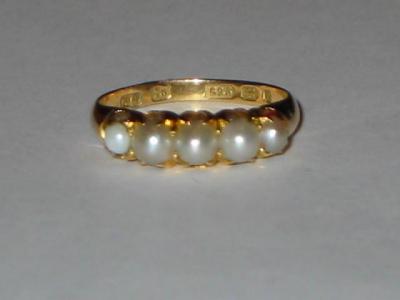 Appraisal: A FIVE STONE PEARL RING the half pearls claw set