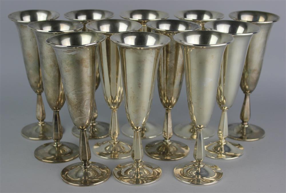 Appraisal: SET OF TWELVE AMERICAN SILVER CHAMPAGNE FLUTES mid th Century