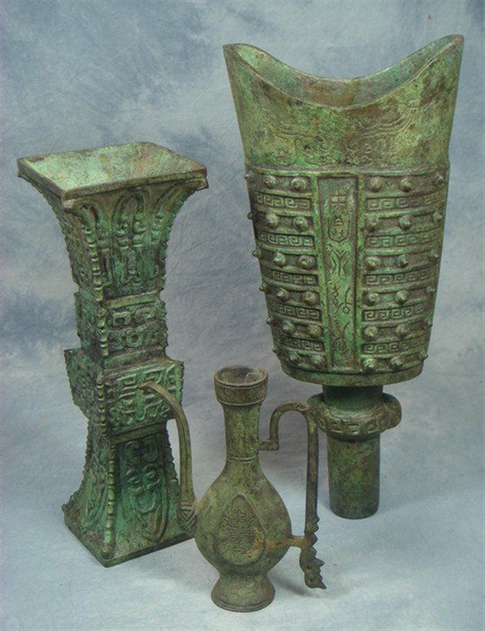 Appraisal: bronze Oriental vessels one a square flaring open container h