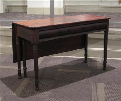 Appraisal: Empire mahogany drop leaf table The rectangular molded top over