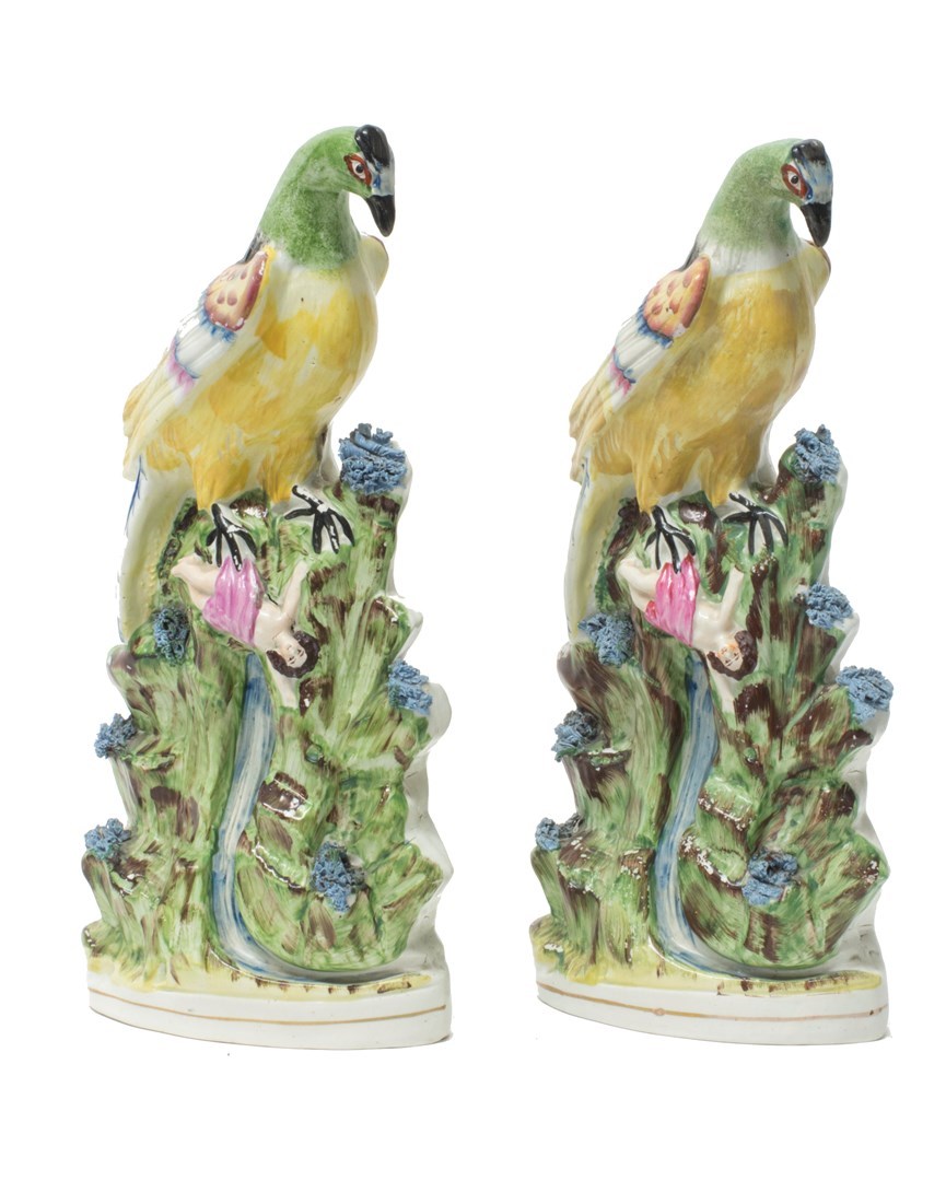 Appraisal: Two similar Staffordshire pottery figures of roc' birds mid th