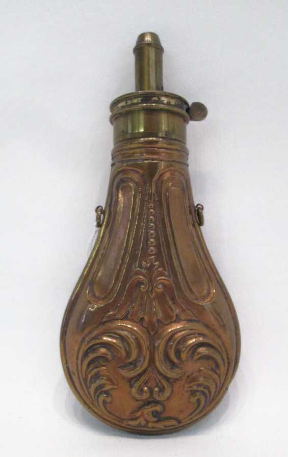 Appraisal: NINETEENTH CENTURY BRASS POWDER FLASK embossed body adjustable powder charger