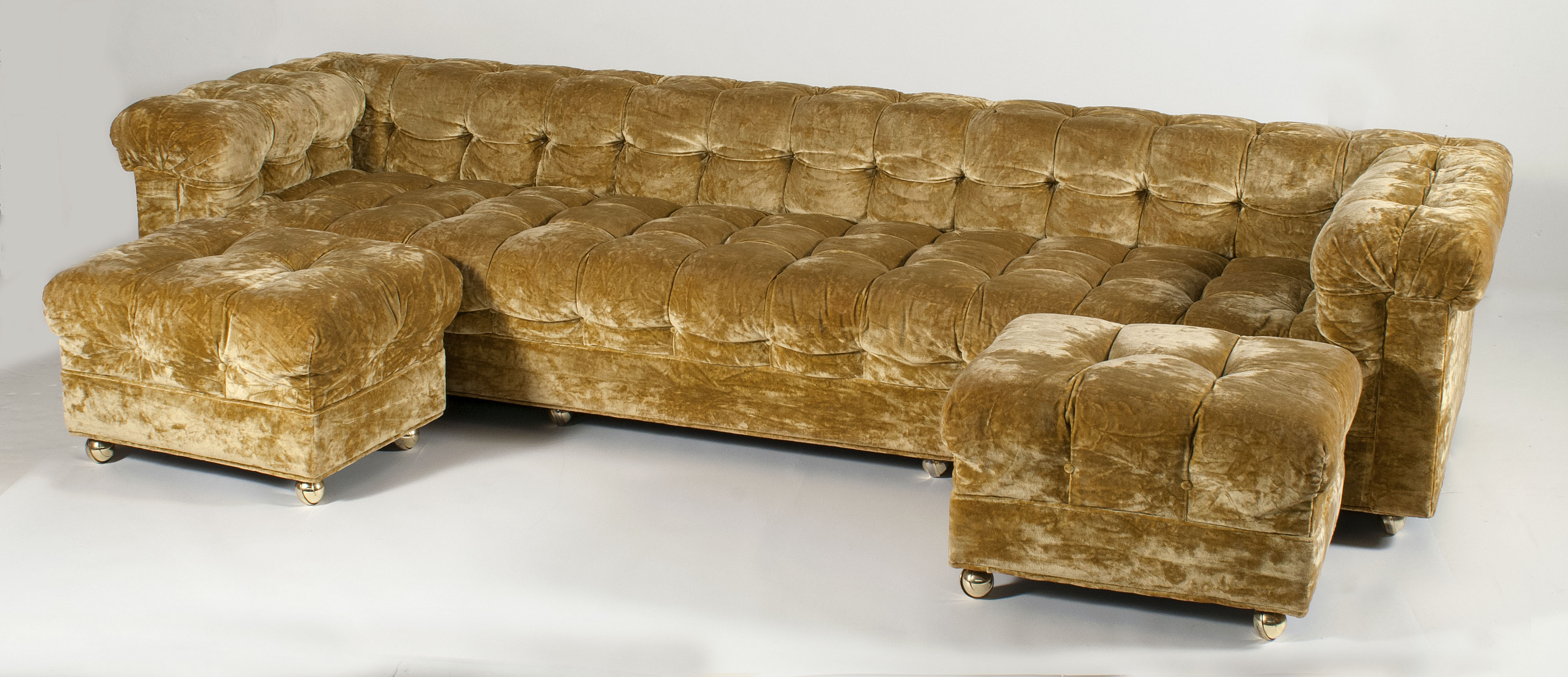 Appraisal: CRUSHED VELVET-UPHOLSTERED SOFA AND TWO OTTOMANS sWith a low boxy