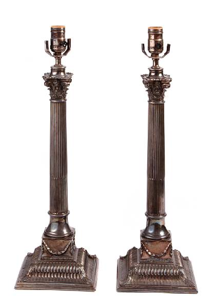 Appraisal: A pair of silverplated table lamps of columnar form on