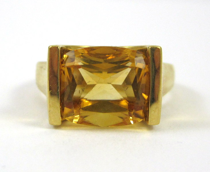 Appraisal: CITRINE AND TEN KARAT GOLD RING set with an oval