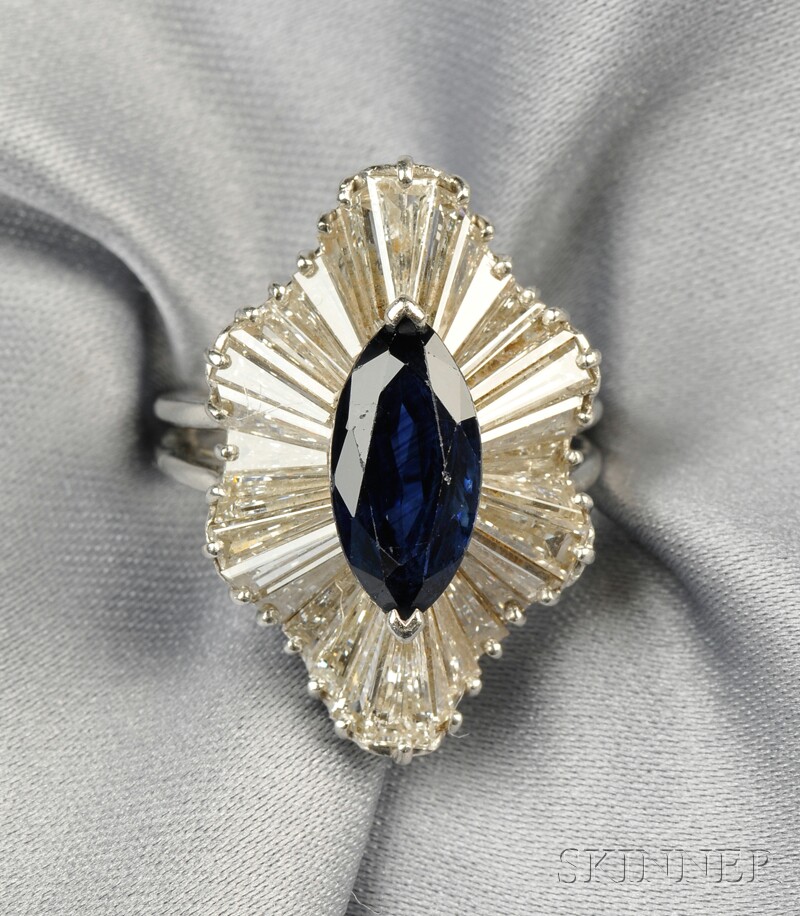 Appraisal: Platinum Sapphire and Diamond Ring set with a marquise-cut sapphire