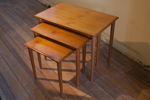 Appraisal: NEST OF THREE TEAK FIT IN TABLES