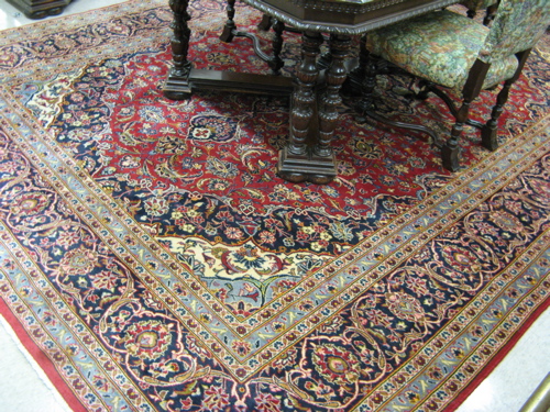 Appraisal: PERSIAN KASHAN CARPET floral and central floral medallion design on