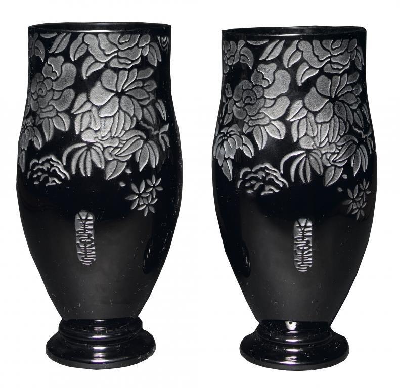 Appraisal: A PAIR OF BLACK GLASS VASES of slightly bulbous form