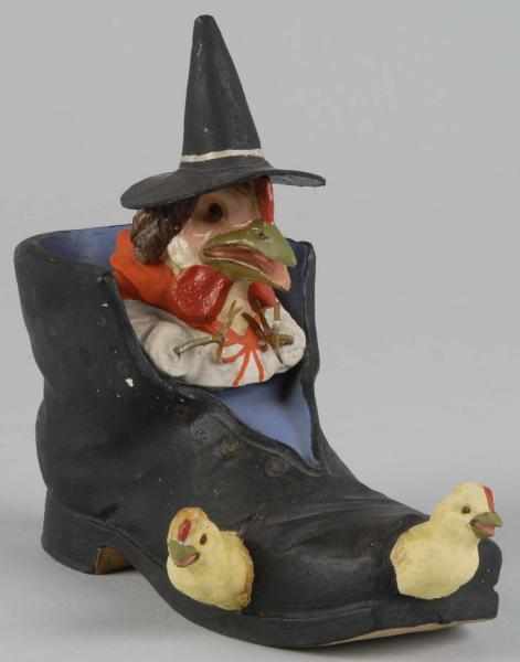 Appraisal: Halloween Rooster Witch in Boot Candy Container Description Boot has