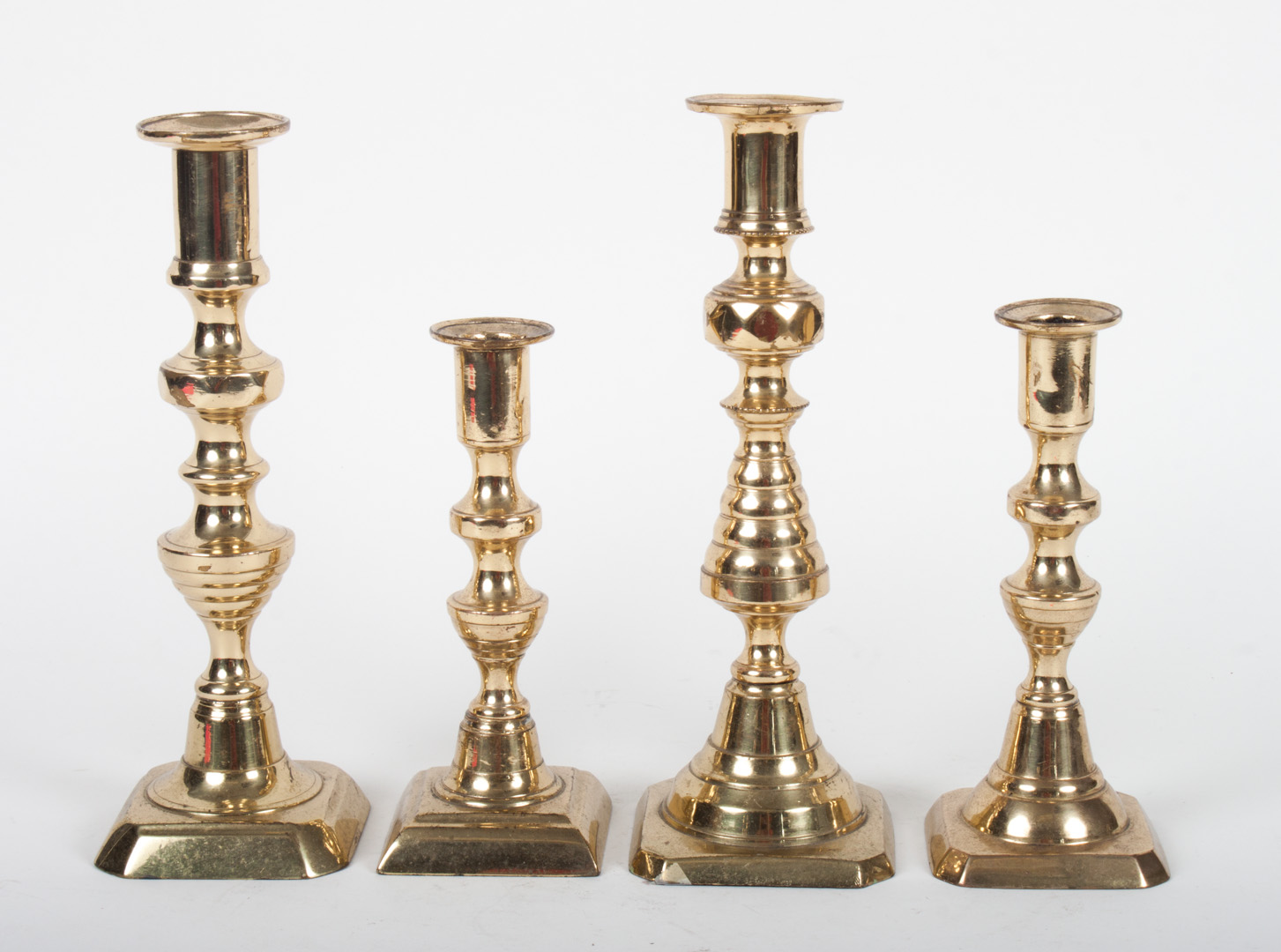 Appraisal: Four Victorian brass candlesticks late th century two beehive candlesticks