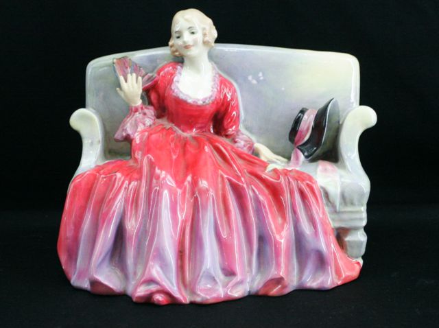 Appraisal: A Royal Doulton 'Sweet and Twenty figurine' damage