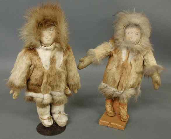 Appraisal: Two Eskimo dolls dressed in animal fur jackets with hoods