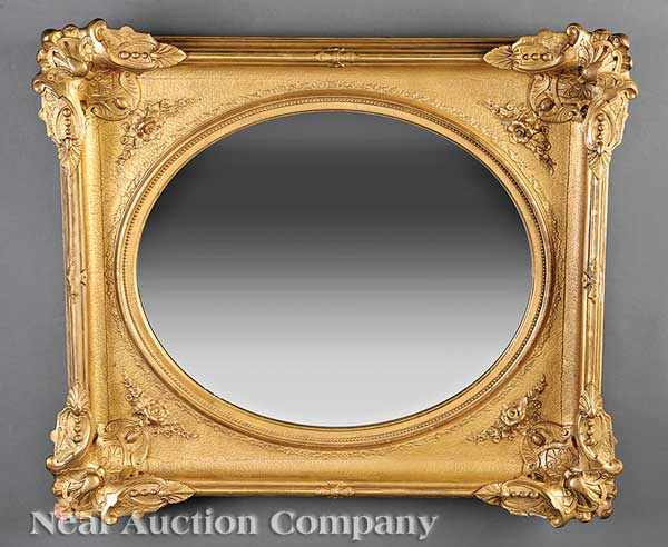 Appraisal: An American Rococo Carved Giltwood Mirror mid- th c molded