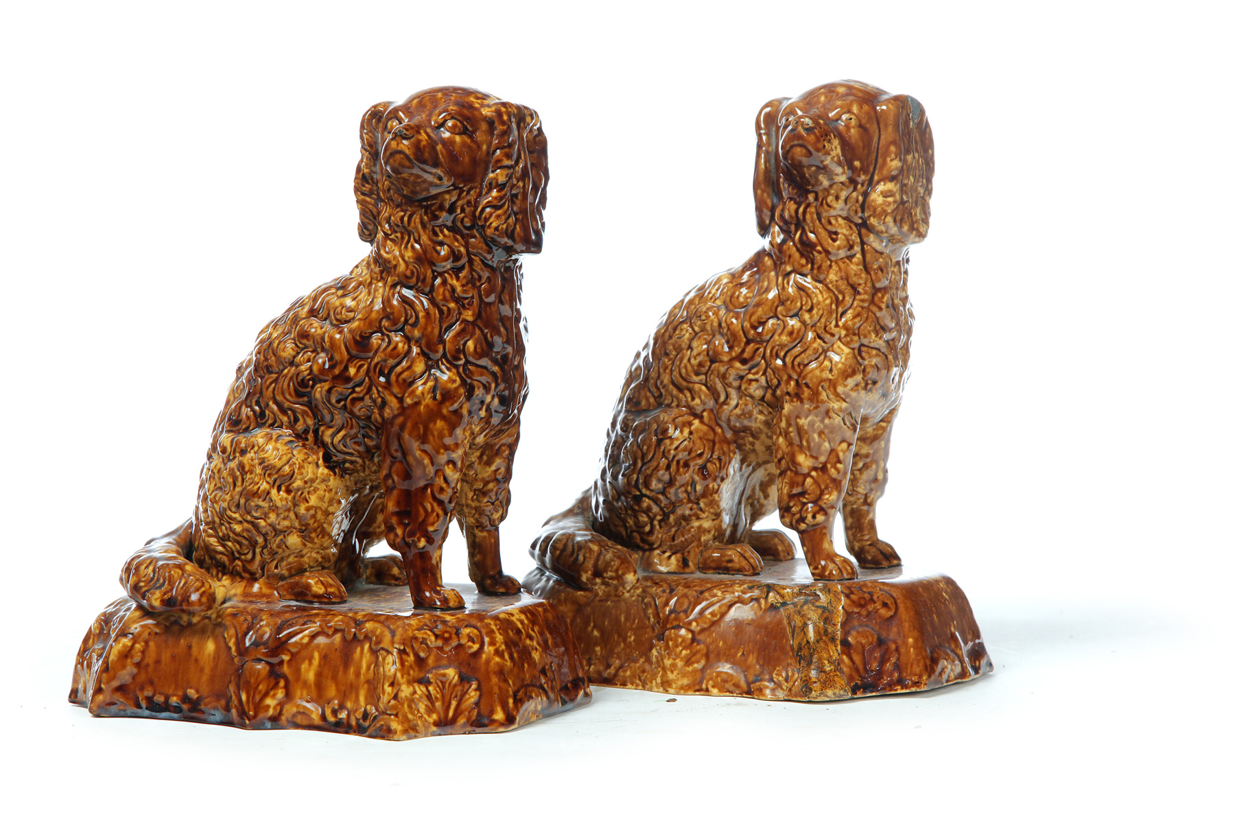 Appraisal: PAIR OF AMERICAN ROCKINGHAM DOGS Mid th century Seated spaniels